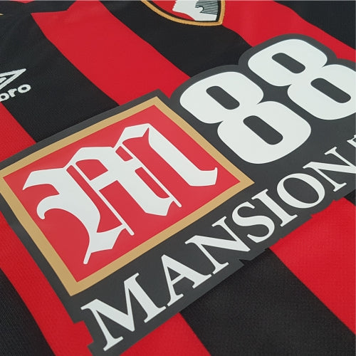 M88 printed logo on a home AFC Bournemouth red and black striped shirt from the 2018/19 season. Printed on the shirt by Footballkitsdirect.com